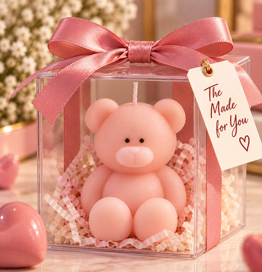 Pink teddy candle in a clear gift box with a ribbon and gift tag